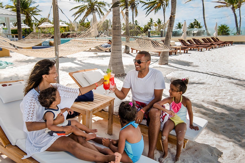 Relax by the beach at the family-friendly Blue Haven Resort in Turks and Caicos.