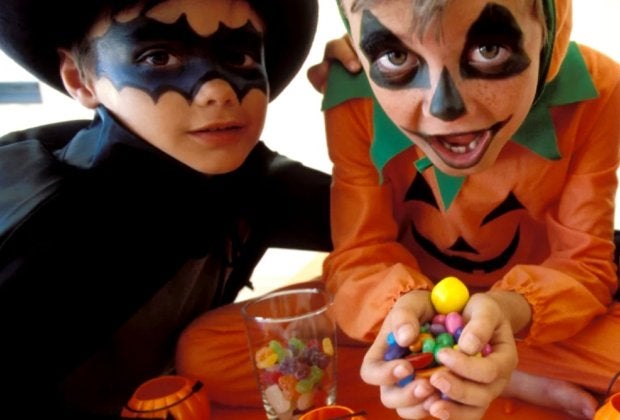 Got too much Halloween candy? We rounded up the best Halloween candy donation programs! Photo by Pixland via Canva